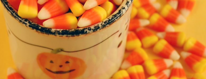 Decorative pumpkin jar full of halloween candy
